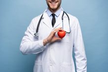 Healthcare And Medical Concept Male Doctor With Heart.